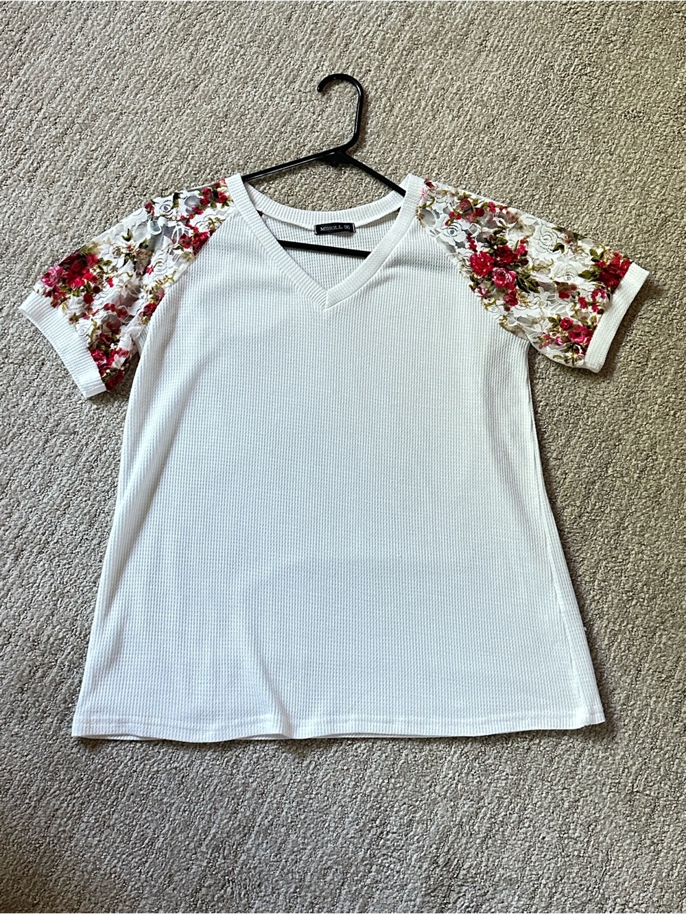 White V-Neck Top with Floral Sleeve Accents